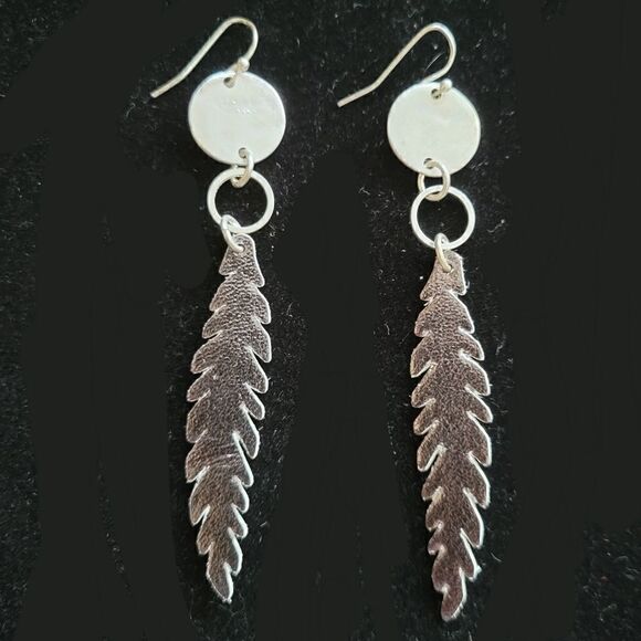 Jewelry - Faux leather feather earrings. Fashion jewelry. Statement jewelry. NWOT